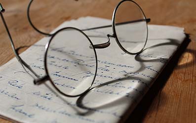 Reading Glasses on Handwritten Letter