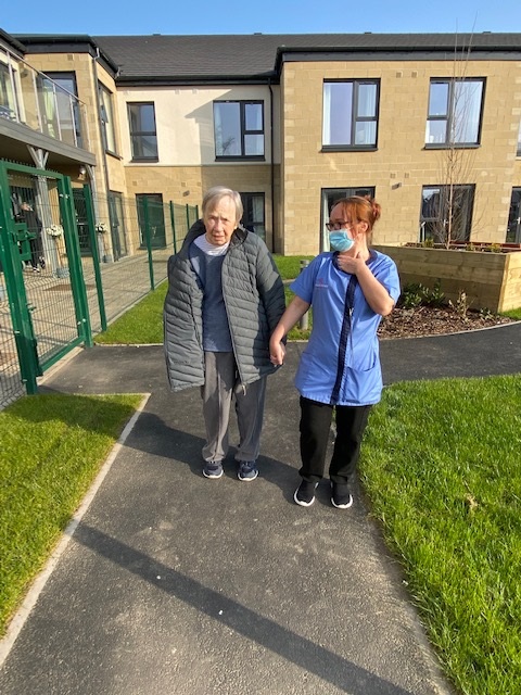 Resident Holding Hands with Roselea Court Staff