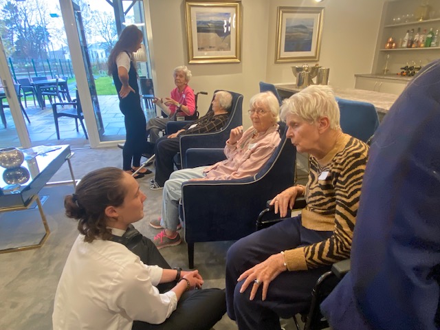 Residents Chatting with Students