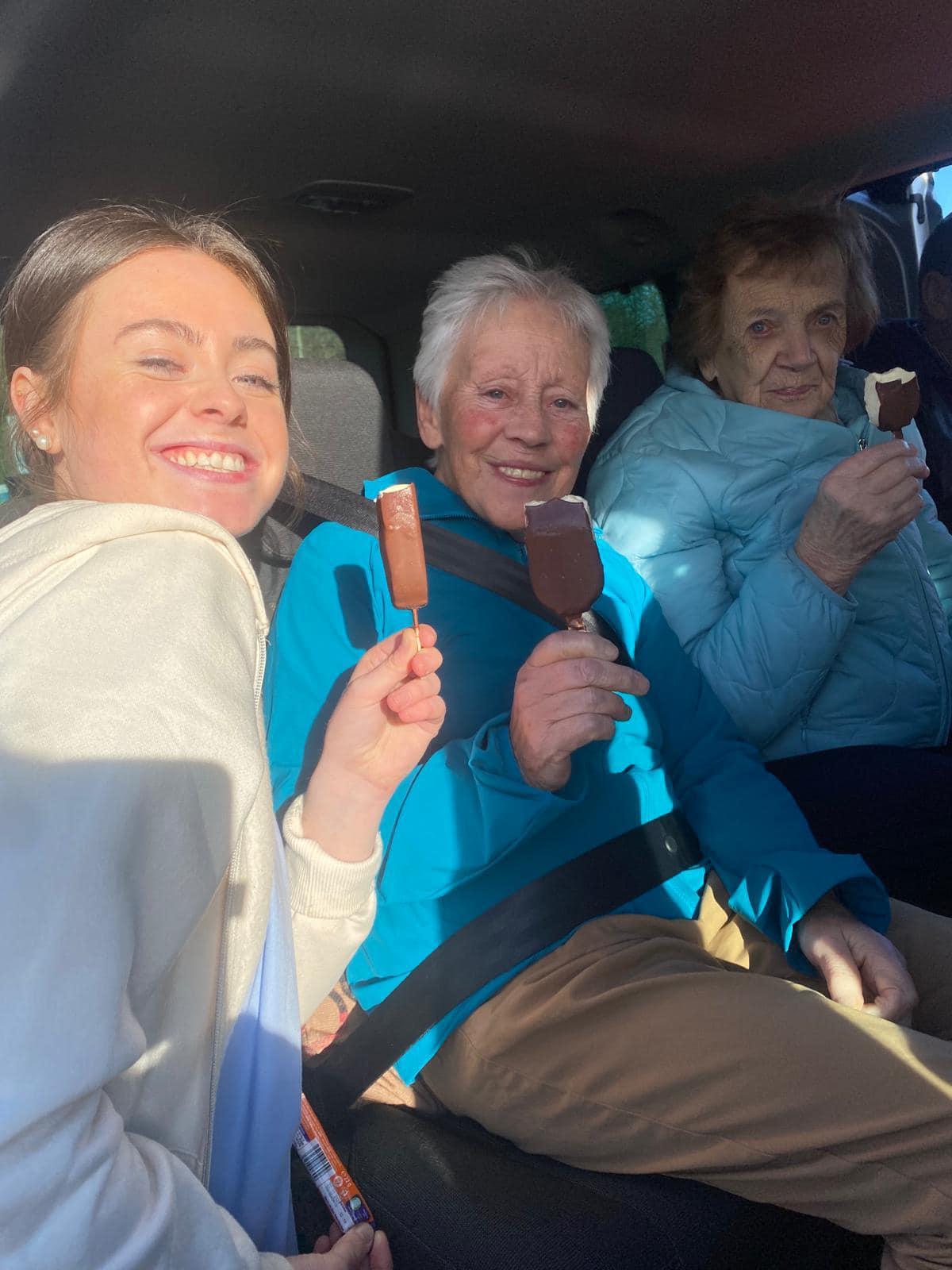 residents having an ice cream in the minivan