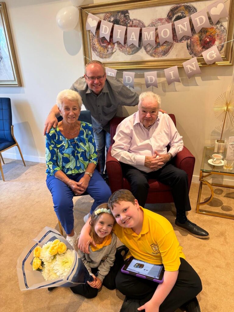 Mr and Mrs Jarvie celebrating their 60th wedding anniversary at Roselea Care Home with staff and residents