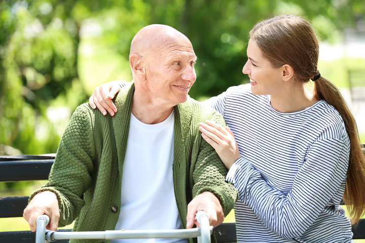 older man with young visitor at care home