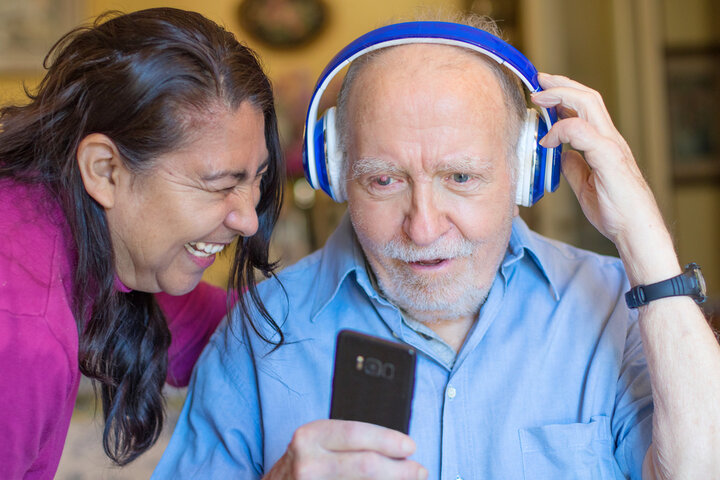 older man listening to music