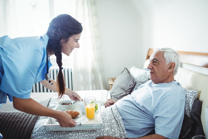 resident getting care in bed