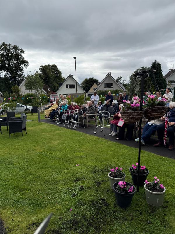 Residents-In-Garden-At-Bandstand-Celebration