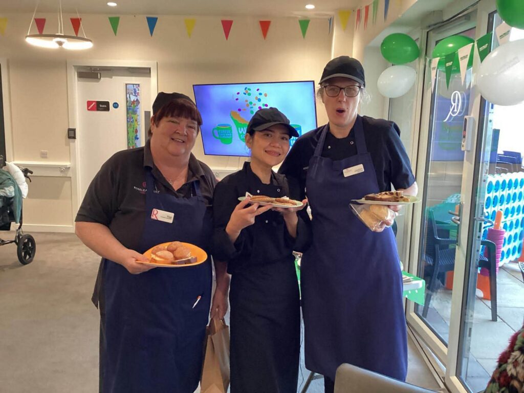 kitchen staff at bakesale for macmillan