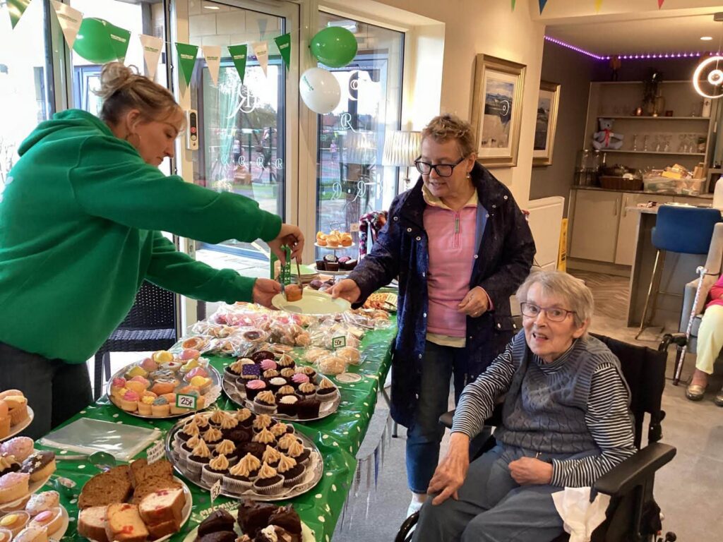 resident and family memeber at macmillan bake sale